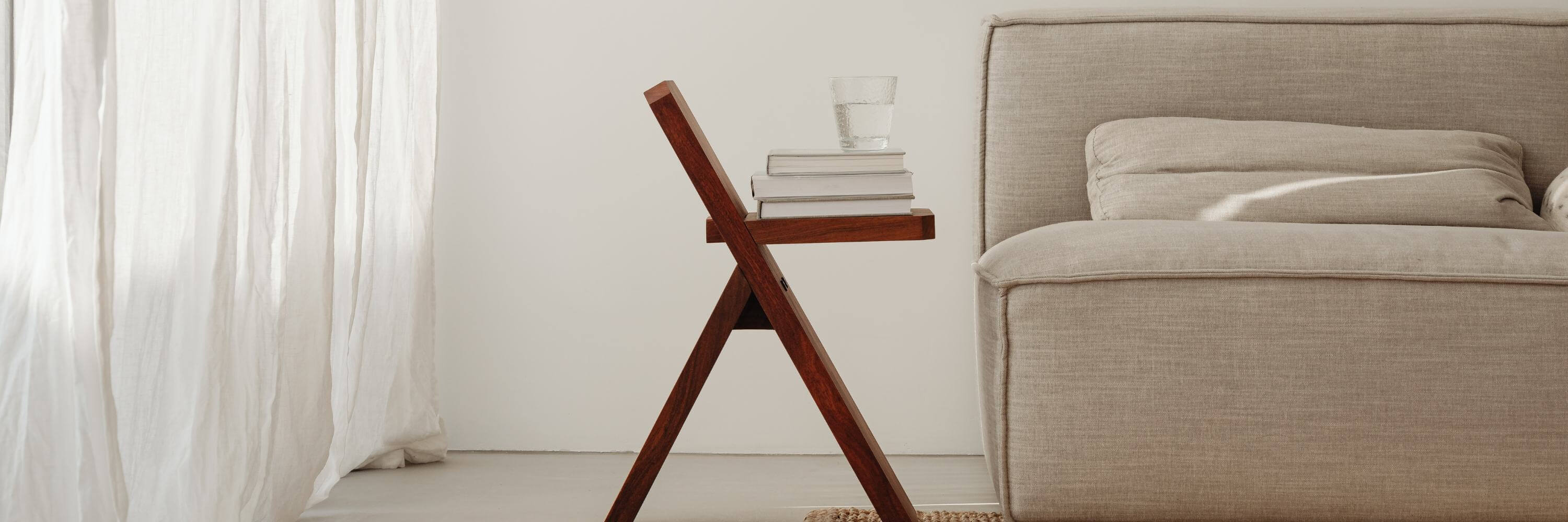 A wooden chair as side table decorated with books