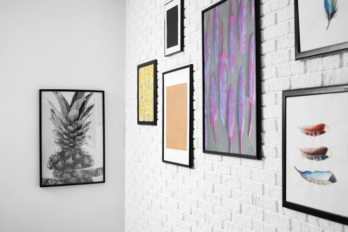Paintings on the white brick wall