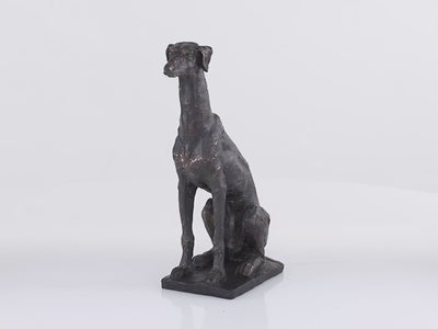Realistic sculpture of a greyhound dog in dark grey color with gold textures. Dog is placed on the squared stand. Figurine is spinning in 360 degrees. Background is all white