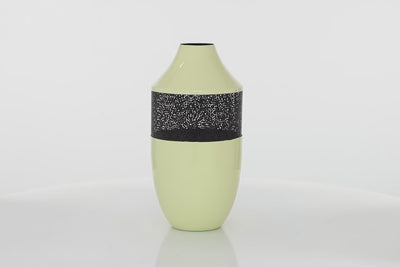 Beige metal oval vase with narrow opening. In the middle of the vase is flower inspired mashed part in black color. The vase is spinning in 360 degrees. Background is all white