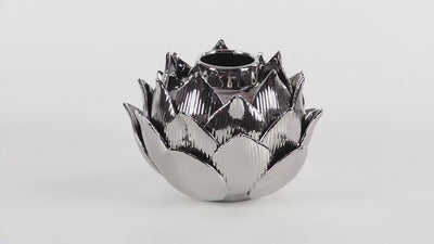 Silver lotus shaped vase with textured leaves and narrow opening. Vase is spinning in 360 degrees. Background is all white