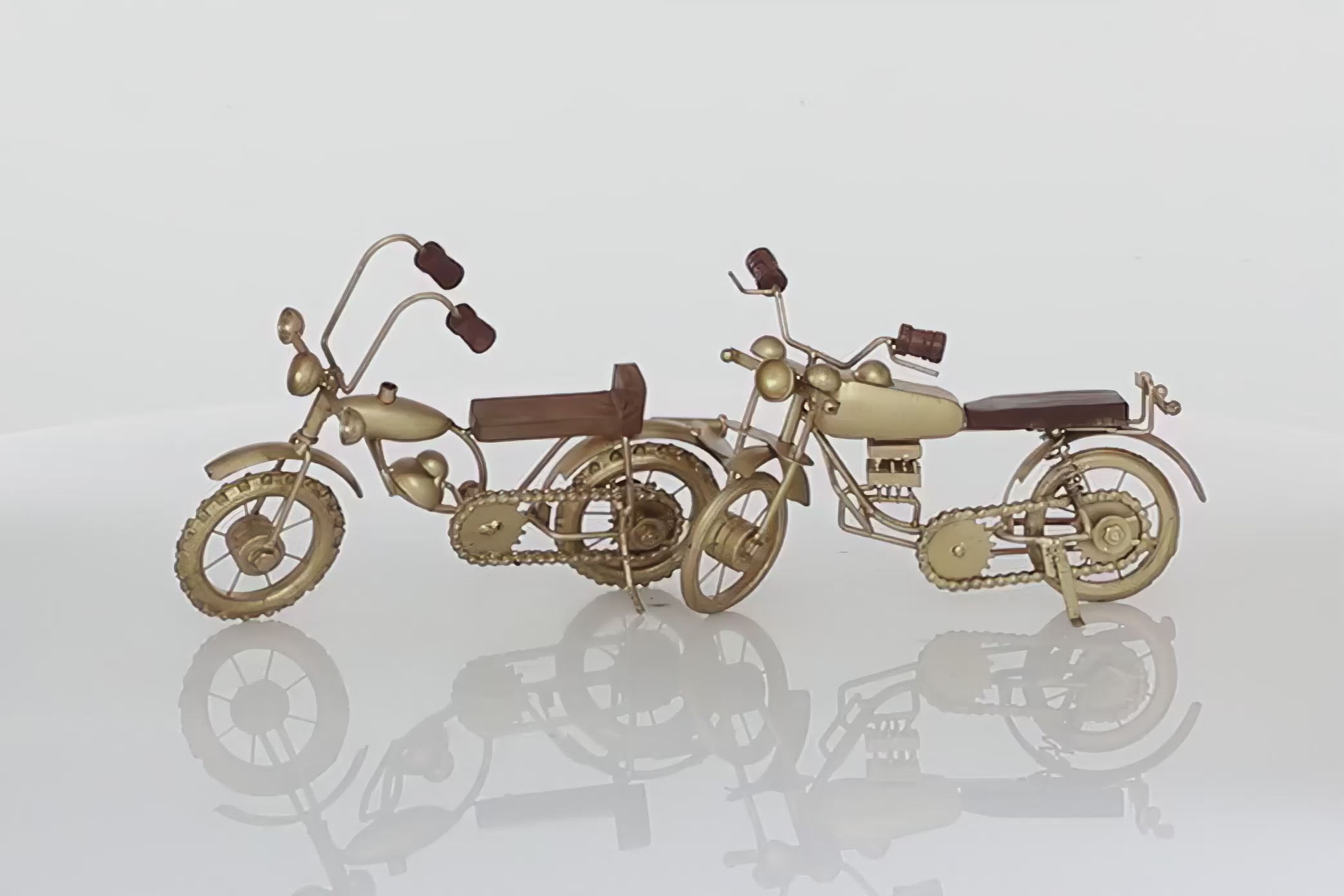 Set of two realistic motorcycles in gold color with wooden handles and seat. Motorcycles are spinning in 360 degrees and background is all white 