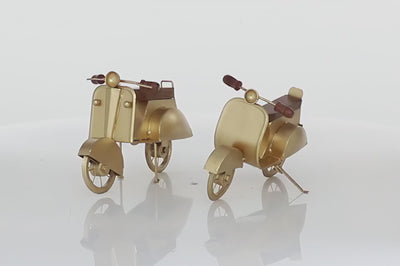 Set of two realistic metal scooters in gold color with wooden seats and handles. Scooters are facing front and are spinning in 360 degrees. Background is all white