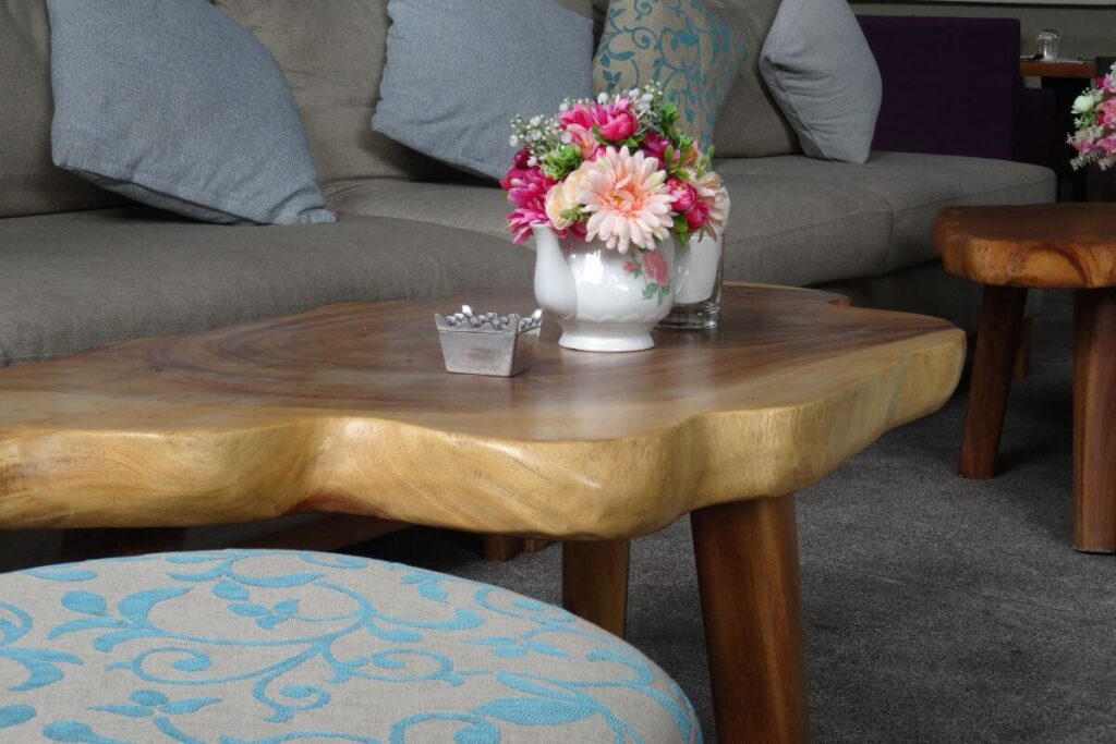 Wooden coffee table with vase decor