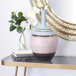 Tall ceramic vase next to a mirror