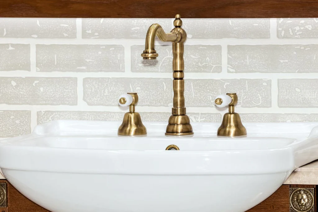 Brass faucet in the bathroom