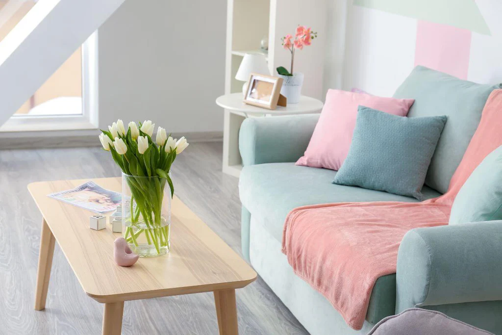 Pastel colored living room with pink and blue sofa