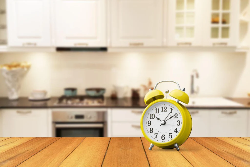 The yellow clock as kitchen decor