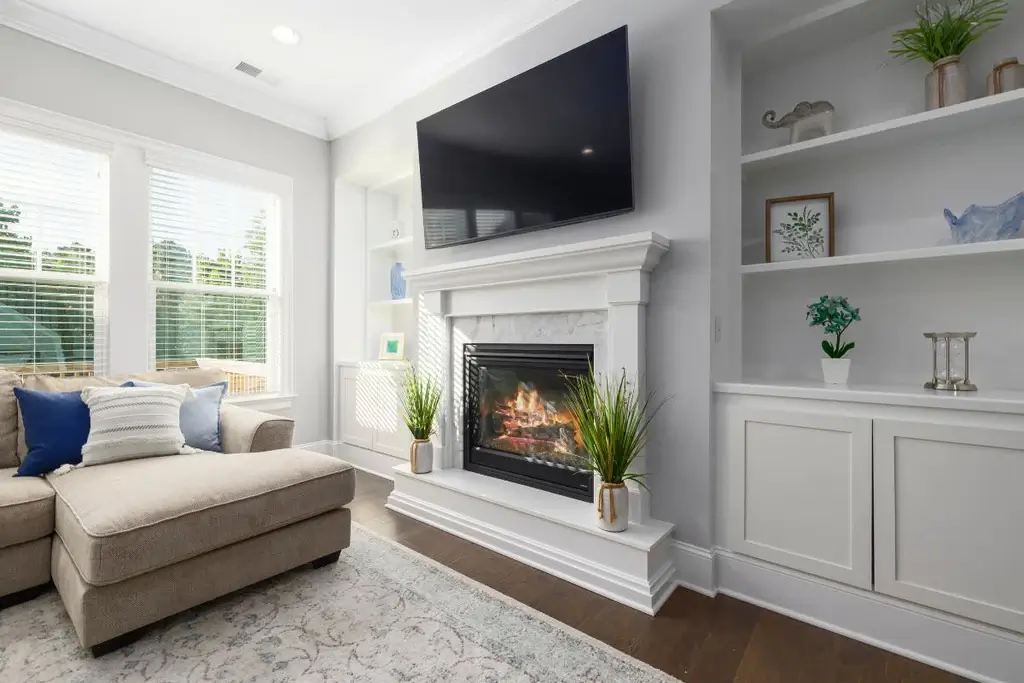 Living room with a fireplace as a TV stand