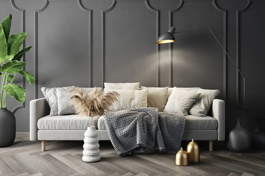 Black floor lamp above grey sofa