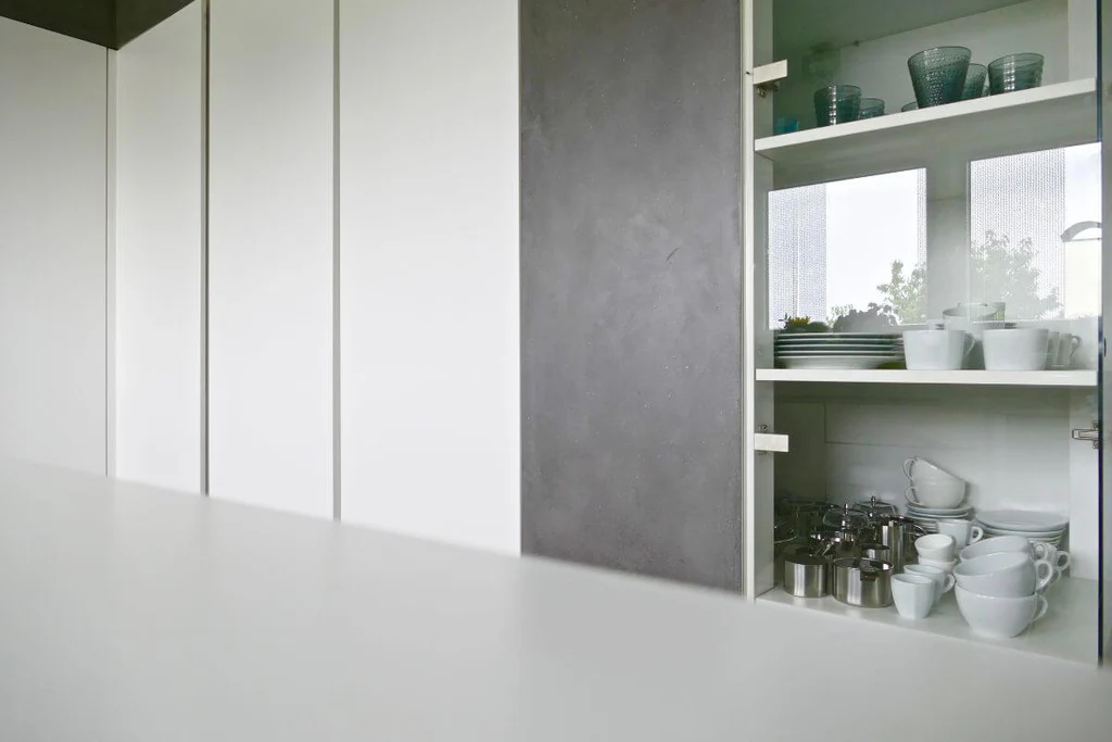 Gray kitchen with glass cabintes