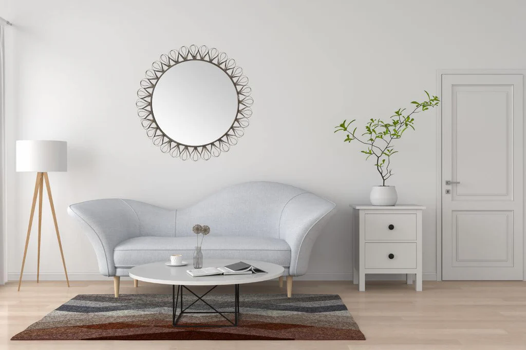 Round metal silver mirror in the living room