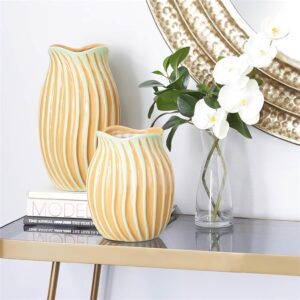 Ceramic orange vases on the side table