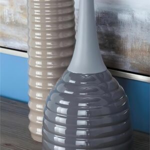 Tall grey vase on a dresser