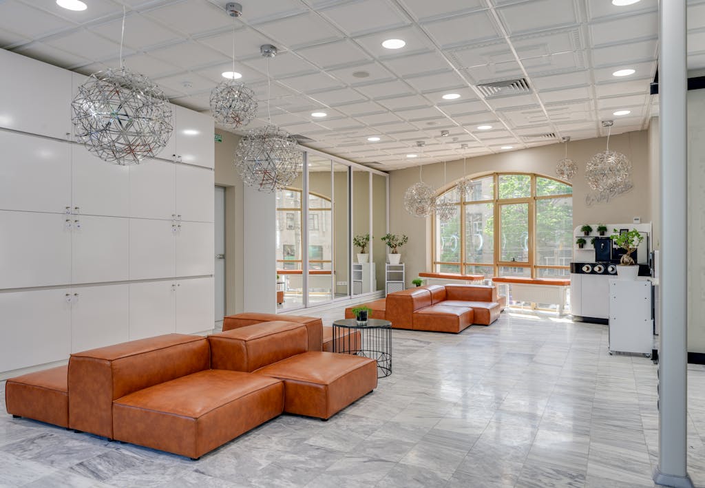 Brown Leather Couches on White Floor Tiles